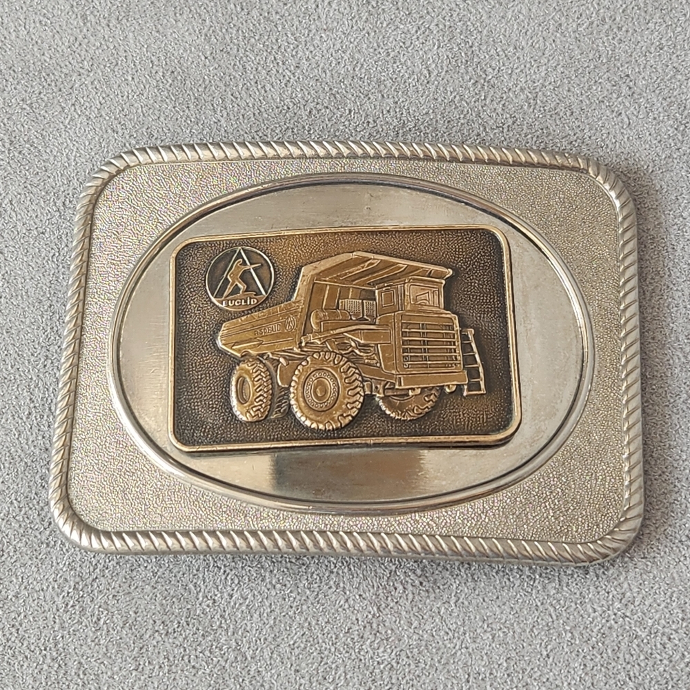 Vintage 80s belt buckle men's silver tone dump truck heavy road machinery USA
